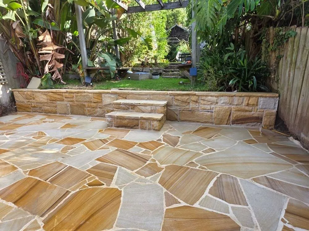 Sandstone retaining wall, steps and terrace paving in Fairlight