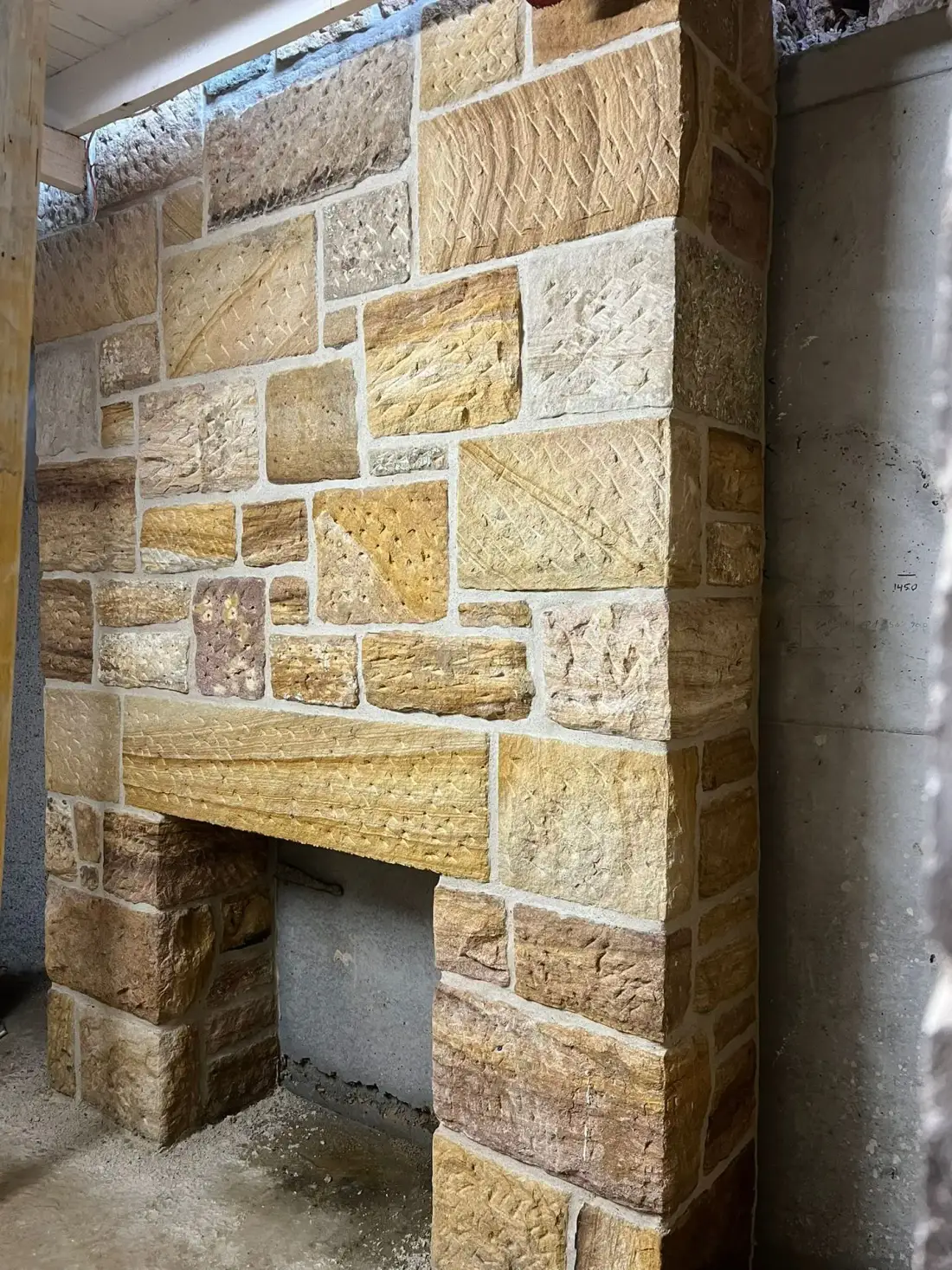 Close detail of carefully matched reused stone and heritage mortar pointing